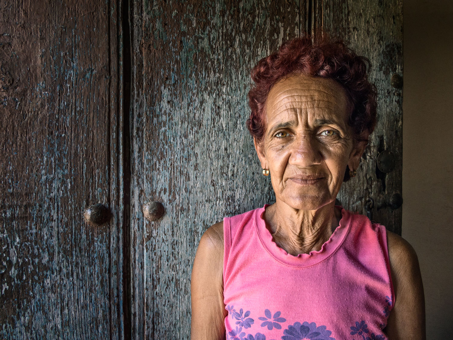 Cuban woman wearing pink shirt